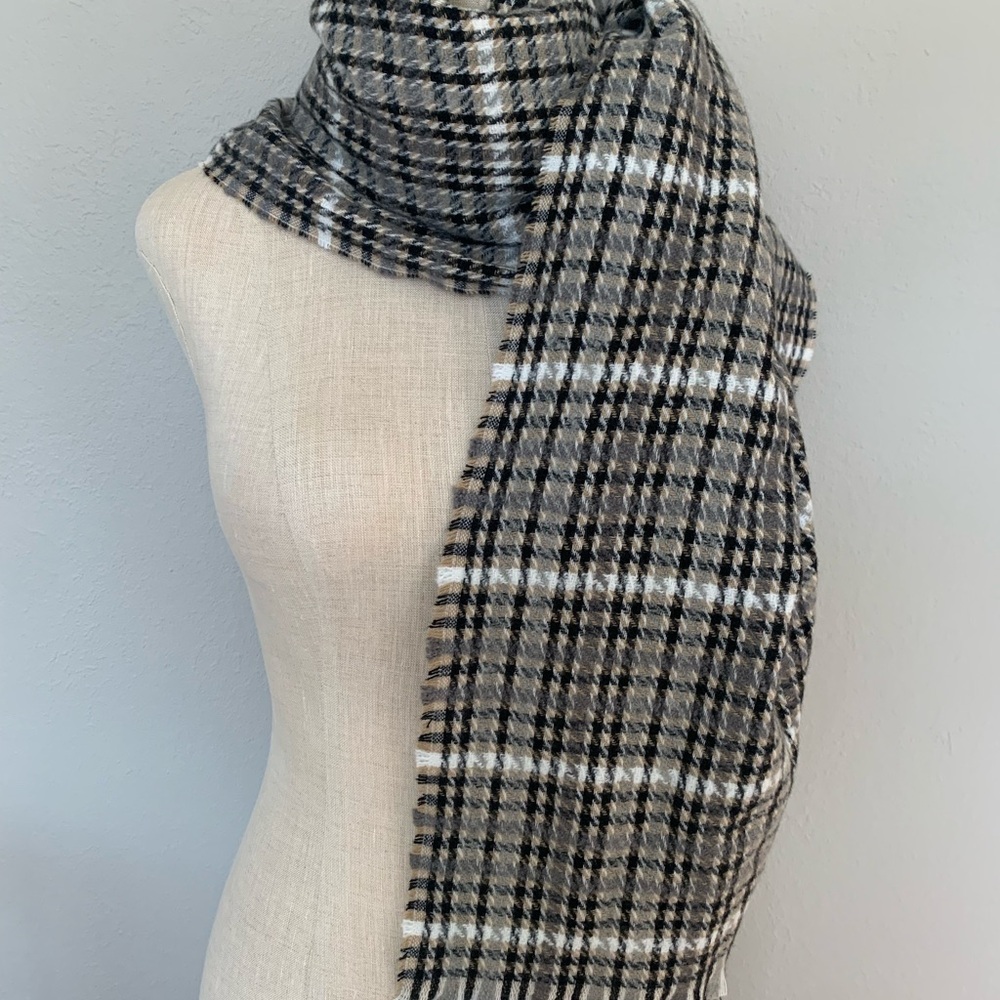 Classic plaid scarf in neutral tones.